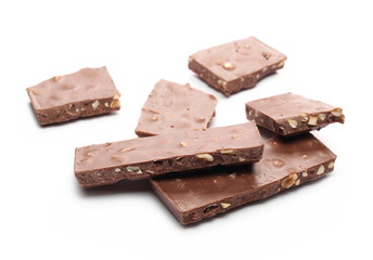 Chocolate with hazelnuts isolated on white background