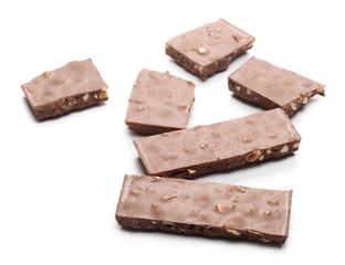 Chocolate with hazelnuts isolated on white background