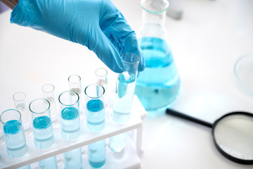 Asian scientist in the laboratory working at lab with test tubes concept