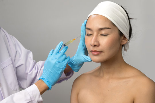 Treatment with botox concept, Asian Woman receiving Botox injection