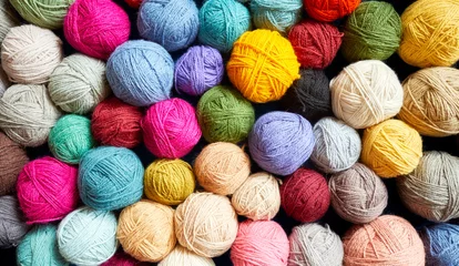 Fotobehang Colorful background made of many wool yarn balls. © MaciejBledowski