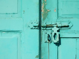 ancient green wood door with latch