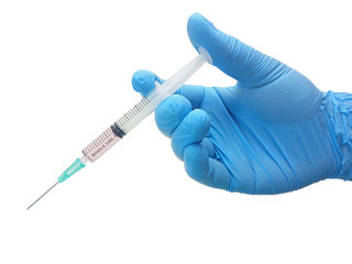 Liquid parenteral products in syringe instrument on the hand of surgeon in blue medical glove isolated on white background with clipping path
