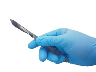 Hand of surgeon in blue medical glove holding a scalpel with blade isolated on white background with clipping path