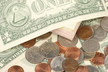 Calculator on banknotes with a pen and pencil. Limited depth of field