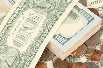 Calculator on banknotes with a pen and pencil. Limited depth of field