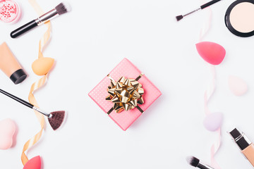 Pink gift box among women's decorative cosmetics