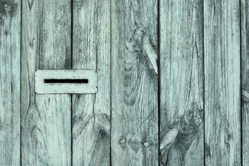 post box hole on wooden fence