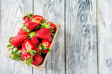 Fresh strawberry on wooden box, copy space