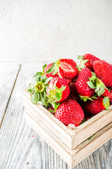 Fresh strawberry on wooden box, copy space