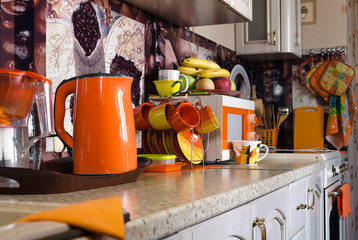 kitchen interior in orange colors, kitchen design in bright color