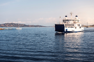 ferry boat sailing between two nearby islands