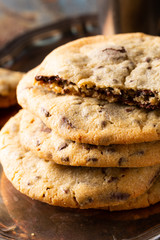 Close up of chocolate chip cookies on old rusty blue table. American cuisine.