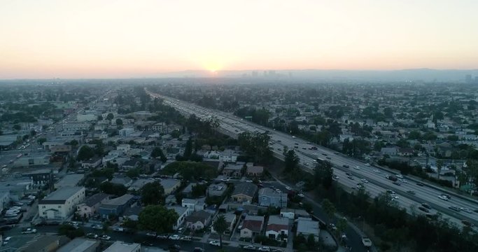 Freeway at dusk in Los Angeles. Slow Motion Santa Monica Freeway DOLLY FORWARD, SLOW MOTION, LONG, CRANE SHOT, AERIAL, HIGH ANGLE, NATURAL LIGHTING, COLOR, OVERHEAD, SEQUENC