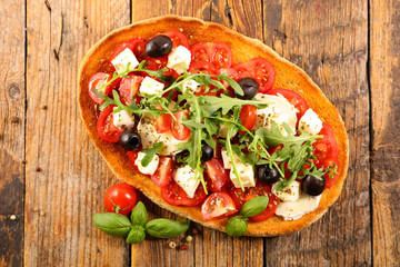 bruschetta with tomato,mozzarella and olive