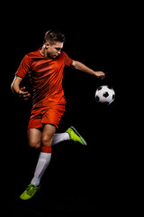 Teenager - soccer player. Boy in football sportswear after game with ball. Sport concept. © Mike Orlov
