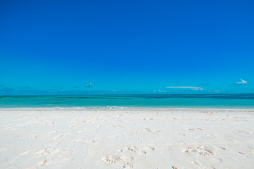 Fototapeta na wymiar Empty tropical beach background. Horizon with sky and white sand. Minimalism tropical beach concept
