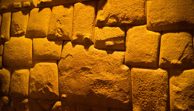 View to Twelve-angled stone aka Hatun Rumiyoc as a part of a wall of the palace of the Archbishop of Cuzco, Peru