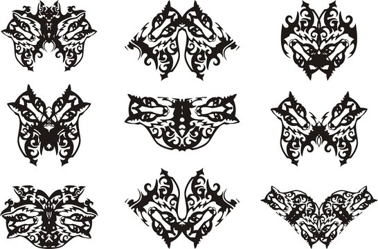 Stylized fox heads in the butterflies form. Unusual patterns in wings of a butterfly, like the fox heads with ornate floral elements for t-shirt designs, an embroidery, a tattoo, etc.