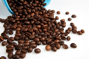 Roasted Coffee beans in a bowl on white background