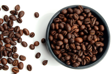 Roasted Coffee beans in a bowl on white background