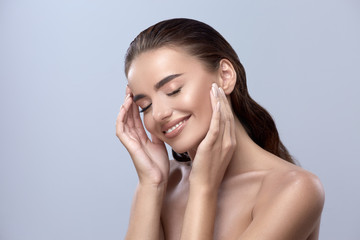 happy woman touching her face, girl smilling with close eyes, healthy happy face