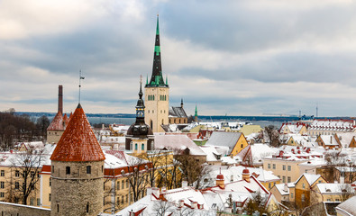 Aerial view of Tallinn city wall and St Olaf Church. Medieval old town panorama in winter time....