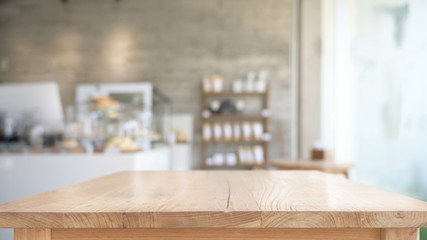 Empty top wooden table in cafe background - obrazy, fototapety, plakaty