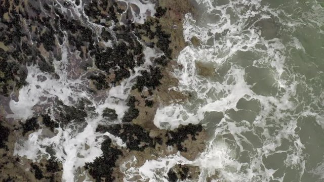Aerial Top View: Strong Waves Crashing on Scenic Seashore in Kerry, Ireland