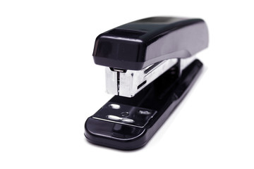 Black stapler isolated on white. Front view