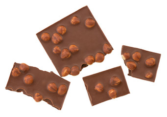 chocolate pieces with nuts isolated on white background