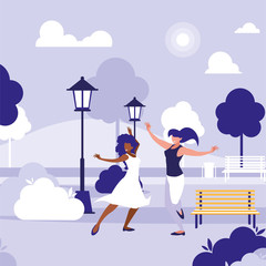 young interracial girls dancing in the park