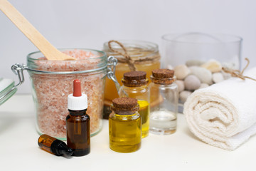 Essential oils and ingredients for homemade cosmetics and scrubs. Skin care concept.