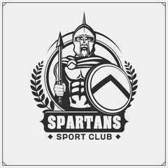 Naklejka premium Spartans emblem and label. Sport club design template. Ancient warrior, spartan spirit, gladiator.