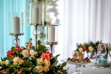 Candles and flowers on festive table