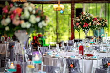 Wedding table decorated with flowers and dishes