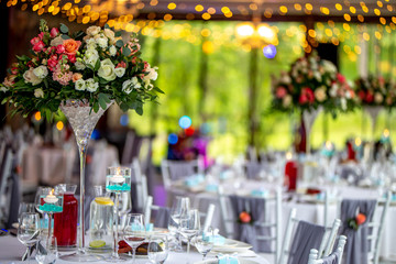 Wedding table decorated with flowers and dishes