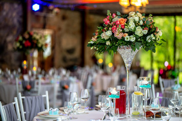 Wedding table decorated with flowers and dishes