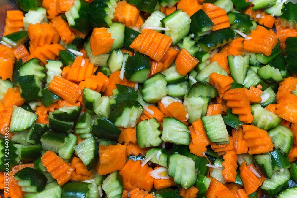 Wall mural fresh carrot and cucumber salad