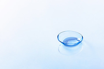 Contact lenses on light blue background. Eyewear, eyesight and vision, eye care and health, ophthalmology and optometry