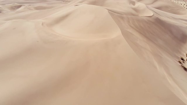 Flight over a desert with beautiful sand dunes - aerial photography
