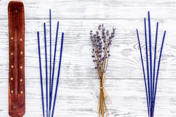 air freshener sticks with lavender on white wooden background top view