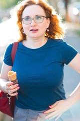 Woman eating ice cream feeling stomach ache.