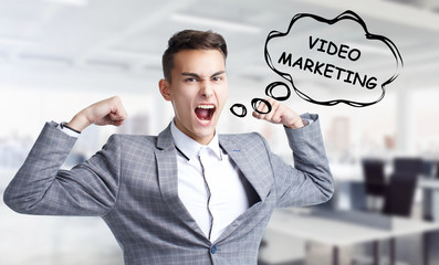 Business, technology, internet and networking concept. Young entrepreneur shouts out a keyword: Video marketing