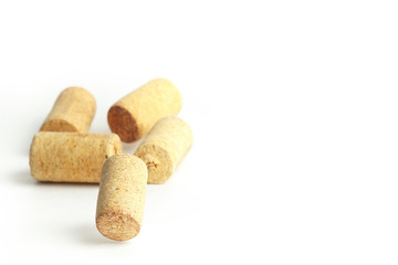 Falling wine bottle caps on a white background