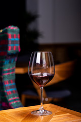 A glass of red wine on the background of the interior in the restaurant