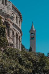 Fototapeta premium The tower of the St Anthony of Padua beside the ampitheatre in Pula