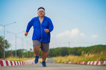 Fat man, he is jogging To lose weight