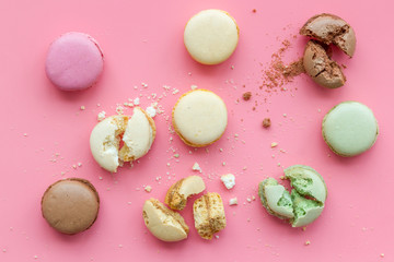 sweet dessert pattern with macarons on pink background flat lay pattern