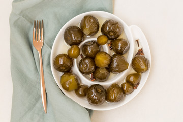 Topview shot of fig jam in white ceramic plate